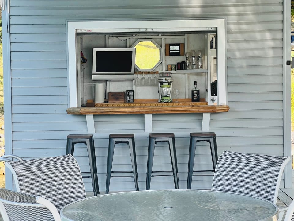 Dock Bar with refrigerator, frozen drink machine, television, sound system