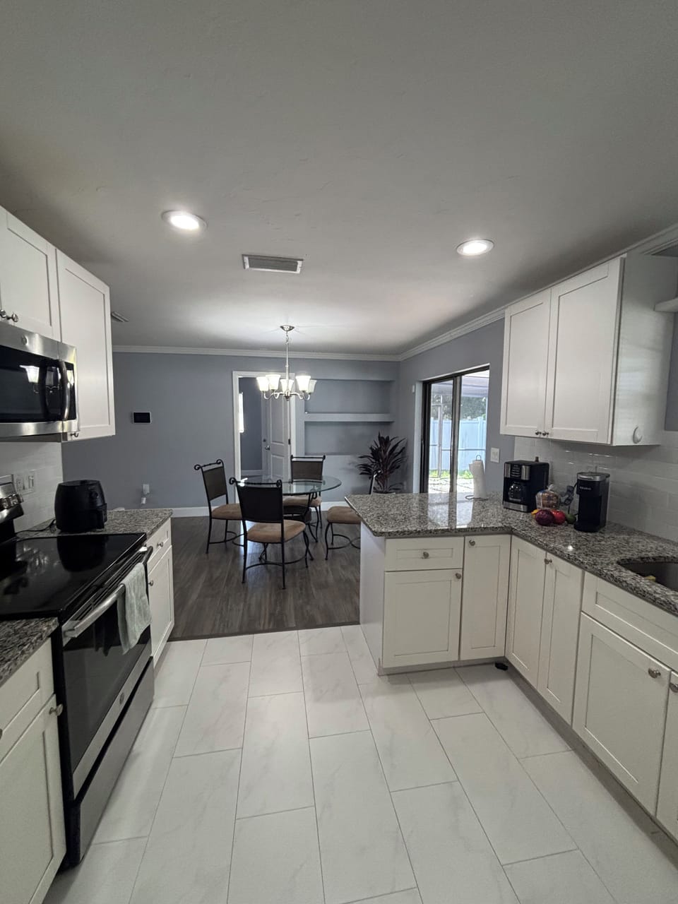 Kitchen dining with modern appliances and kitchen cabinets 