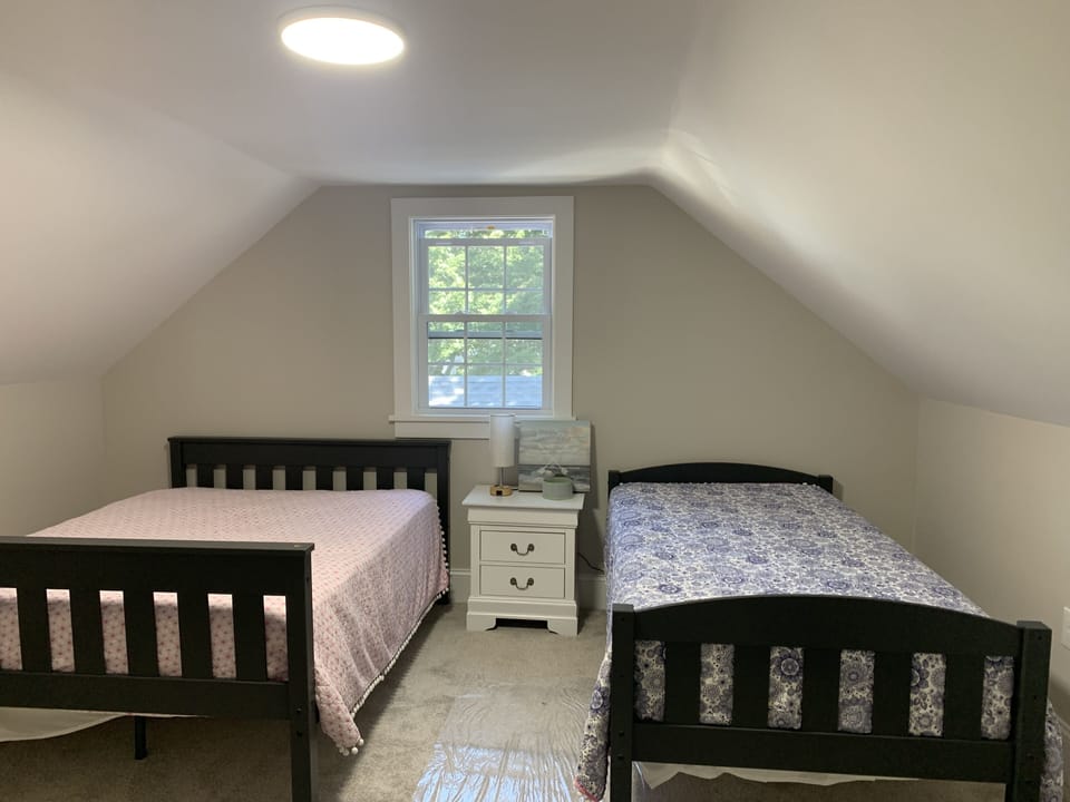 Upstairs bedroom with full and twin bed