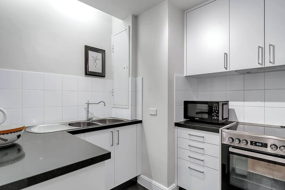 The corner kitchen is fully-equipped with everything you'll need to whip up a meal at home.