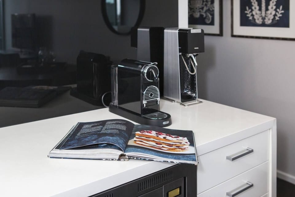 The streamlined kitchen has everything that’s needed to prepare meals at home, including a dishwasher for easy clean-up.