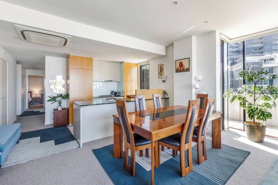 A large dining table makes it easy for guests to come together for a shared meal at home.