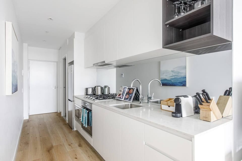  The sleek kitchen makes it easy to prepare meals at home, but you’ll also find abundant eateries close by.