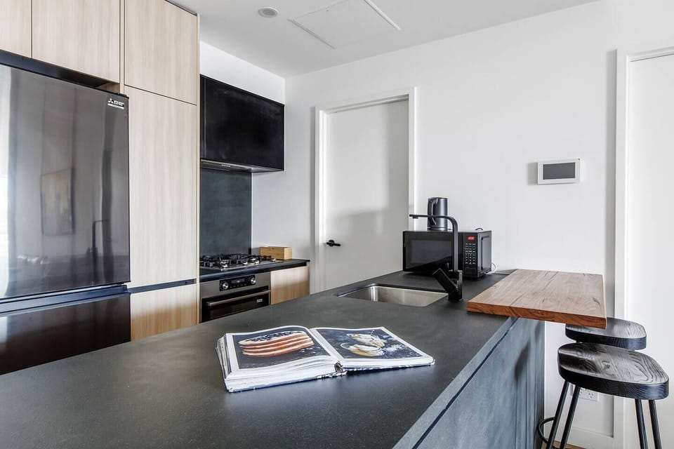 The well-equipped kitchen has all you need to cook meals at home, with seating available at the breakfast bar. 
