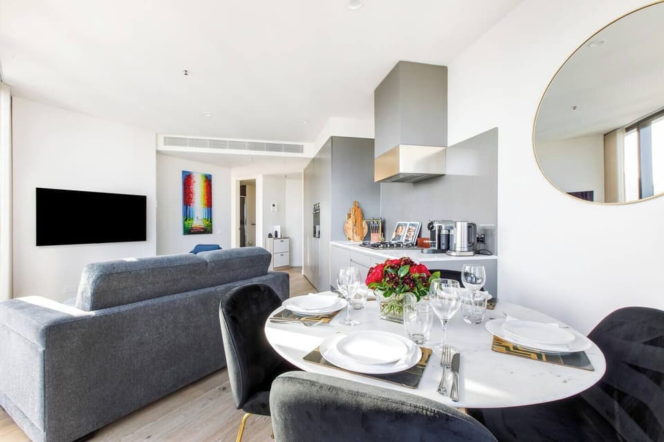 Dine together on the chic marble look round table with a stylish gold base. The dining chairs seat four and are a comfortable cushioned silver velvet look. 