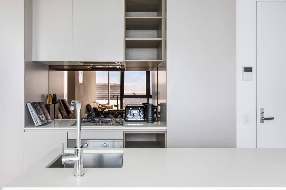 A full kitchen makes it easy to prepare meals at home, with a four-person dining table.