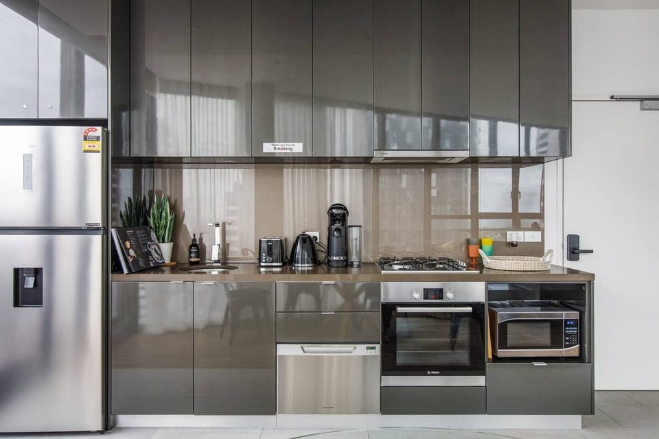 The sleek, streamlined kitchen has everything that’s needed to prepare meals at home including a coffee machine. 
