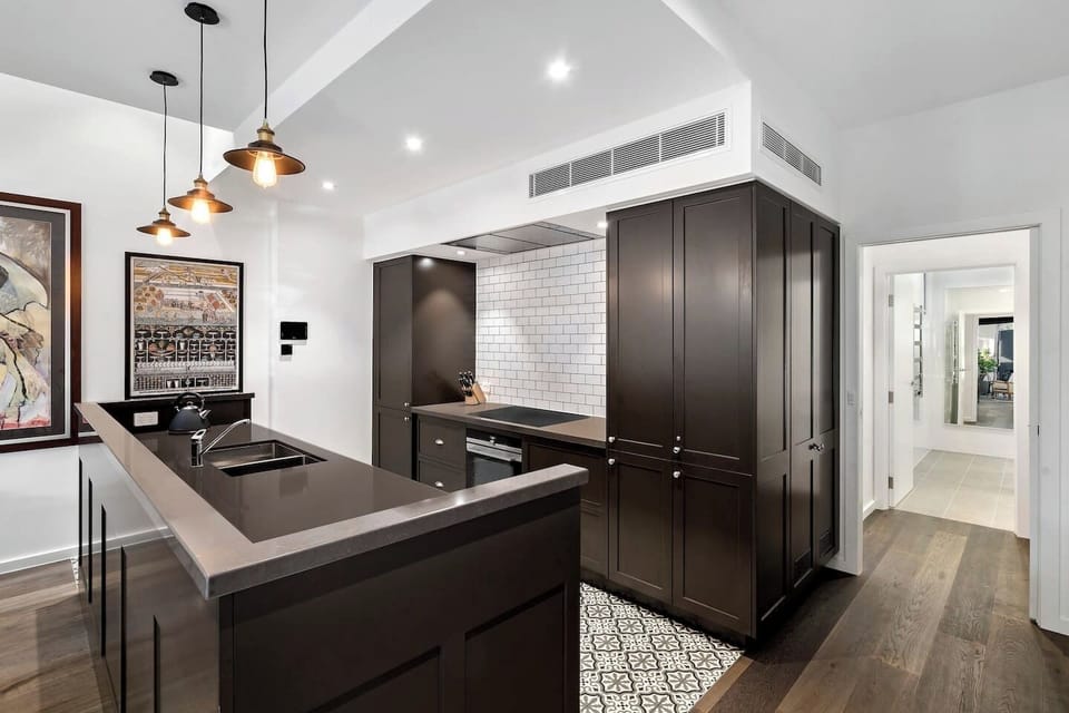 The gourmet kitchen is spacious and well-equipped.