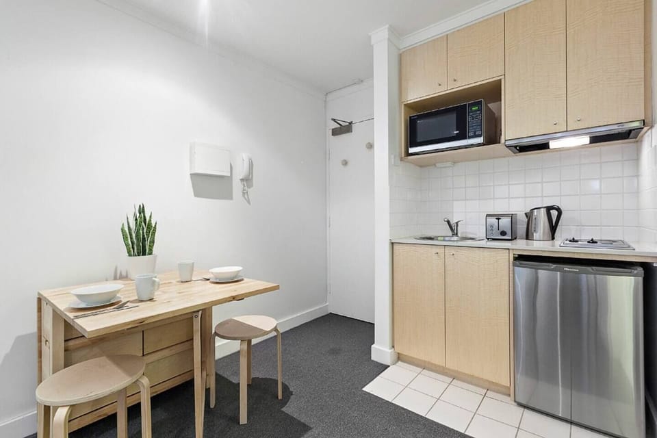 Cook a quick bite in the kitchenette before setting up your laptop and getting to work at the dining table or out on the enclosed patio.