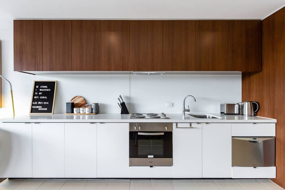 The kitchen is sleek and modern, offering all the essentials, plus a dishwasher for easy clean up.