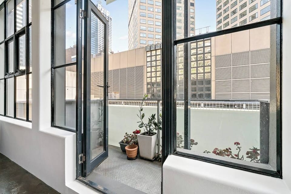 balcony with views down flinders lane