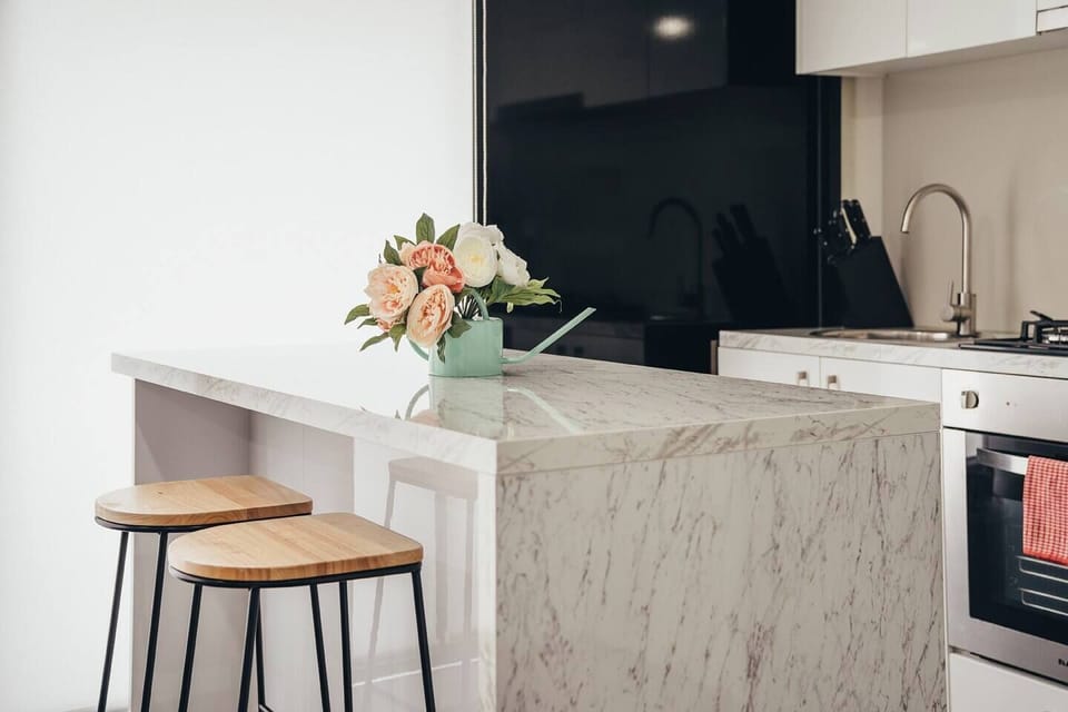 The kitchen island doubles as a convenient casual dining area for easy breakfasts.