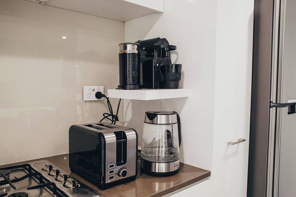 Get your morning caffeine fix without even leaving the house, making use of the provided Nespresso machine and milk frother.