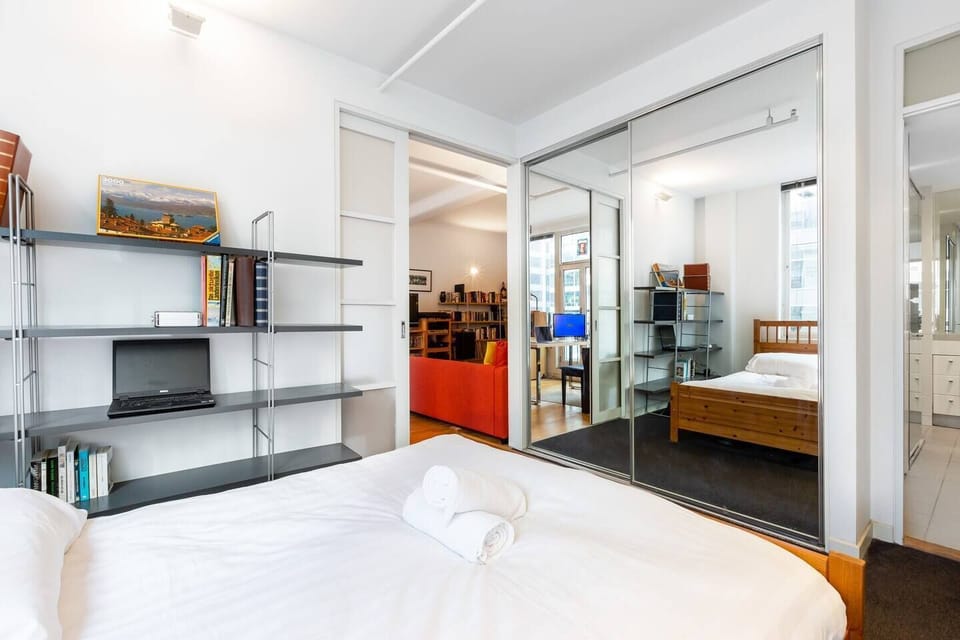 Sliding doors separate the bedroom from the living area. Store your belongings in the mirrored wardrobe and enjoy direct access to the ensuite bathroom.