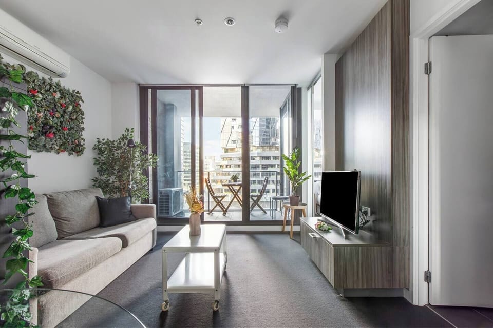 Relax in the inviting living area that opens up to a balcony for a seamless indoor-outdoor experience.