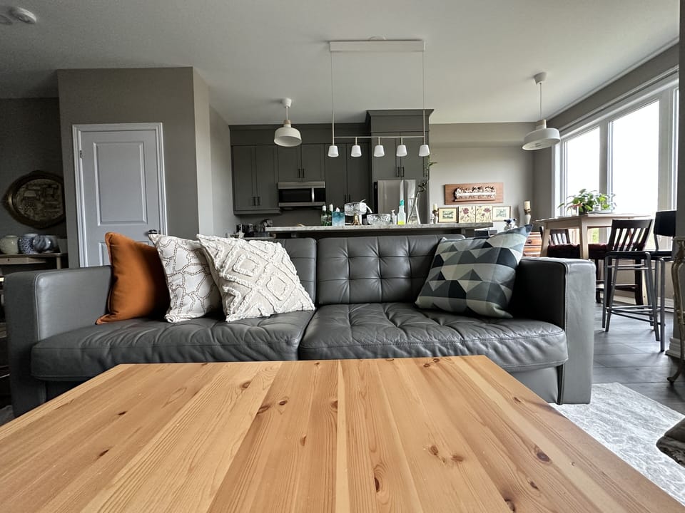 The open concept living room, kitchen and dining areas.