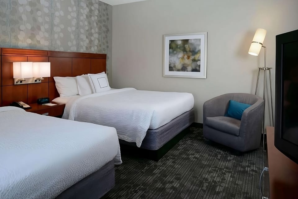 Relax after adventures in plush beds and a quiet lounge chair.