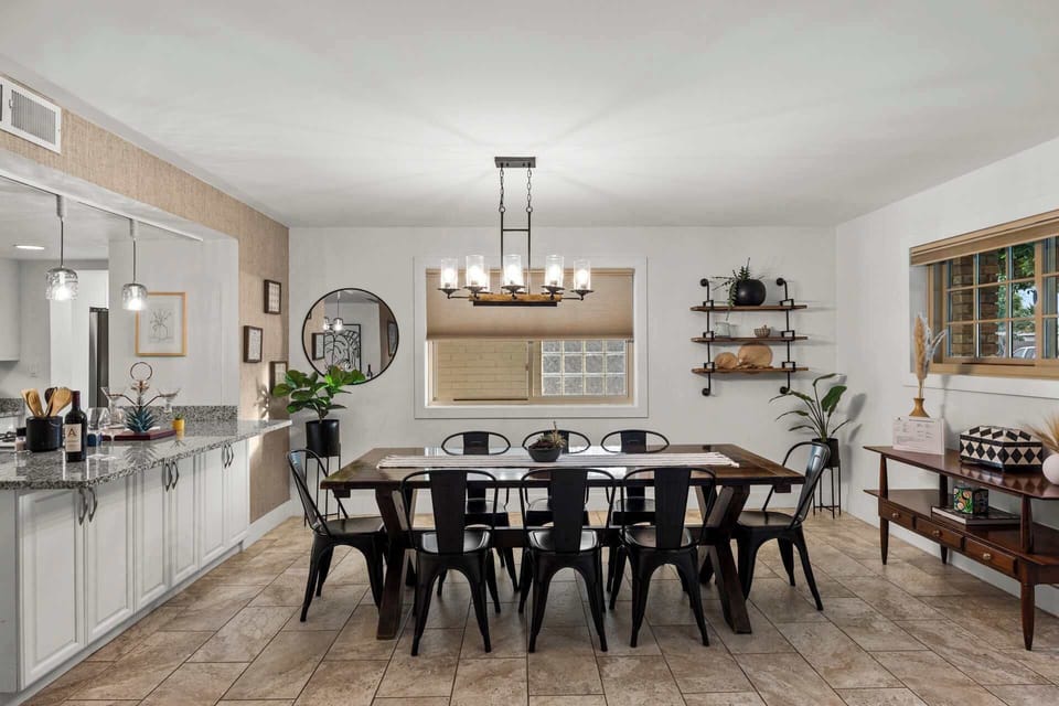 Gather around the large farmhouse-style table with seating for your entire group.