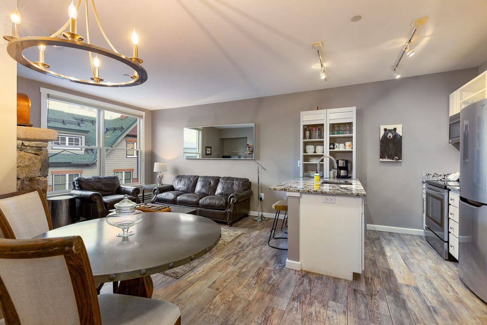 Fully renovated condo with open floor plan, gas fireplace, and private balcony.
