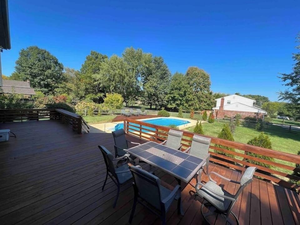 Bar top seating for six overlooking pool. Table for six overlooking pool and park tennis courts.