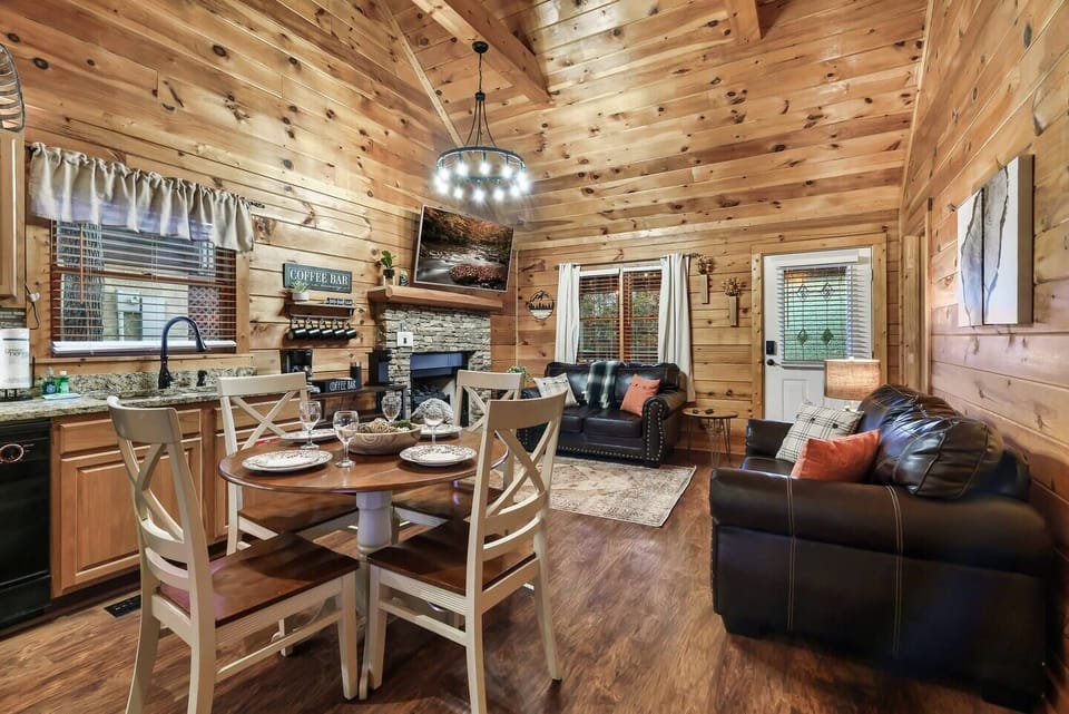 Seamlessly connected living room, dining area, and kitchen await your enjoyment.