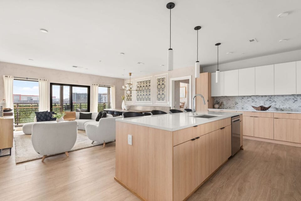 A fully equipped kitchen, stocked with coffee, tea, and condiments, along with a dining table to enjoy homemade meals.