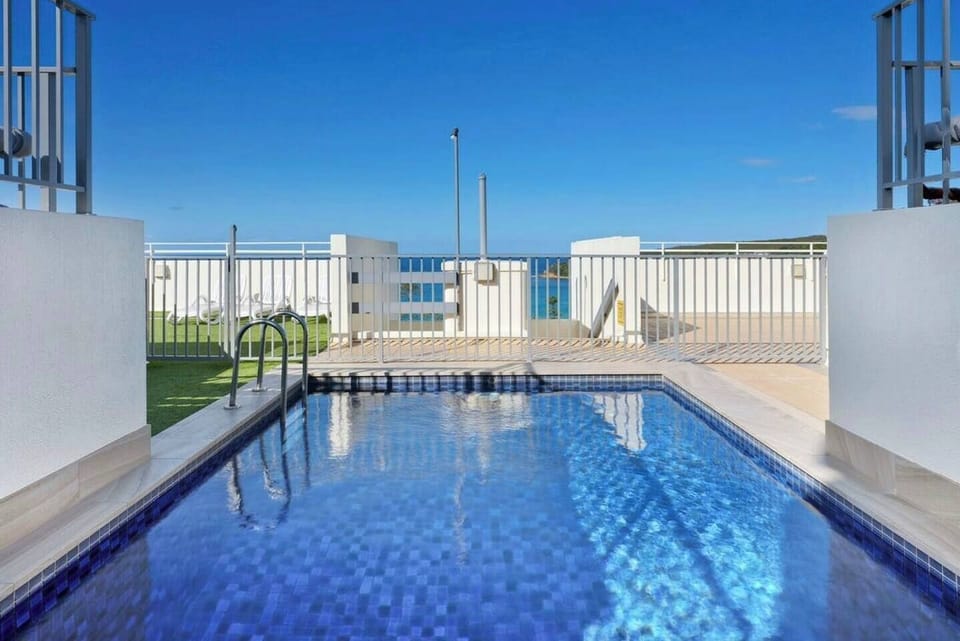 Retreat to the building's rooftop pool, offering beautiful waterfront views.