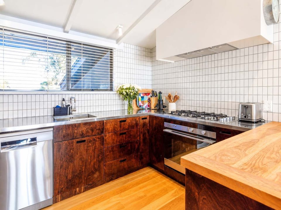 Kitchen with Nespresso coffee pod machine with 1 packet of coffee pods provided