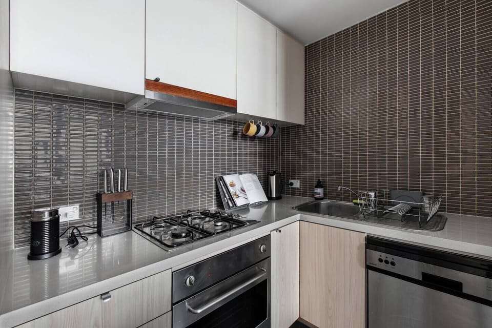 The compact kitchen is well equipped with an oven, stove and dishwasher for easy clean-up.
