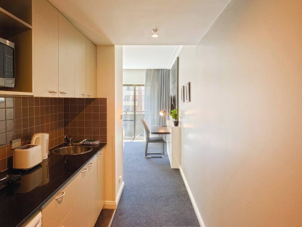 Prepare light meals in the kitchenette, where you'll find a kettle, toaster, microwave and cooking basics such as pots, crockery and utensils.