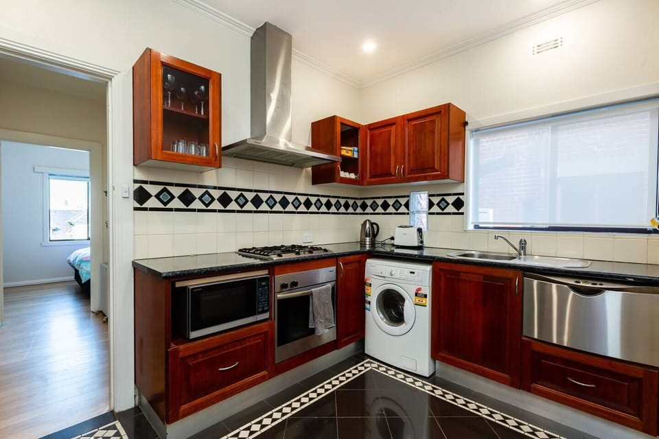 Original tiling in the kitchen adds to the overall character of this apartment.