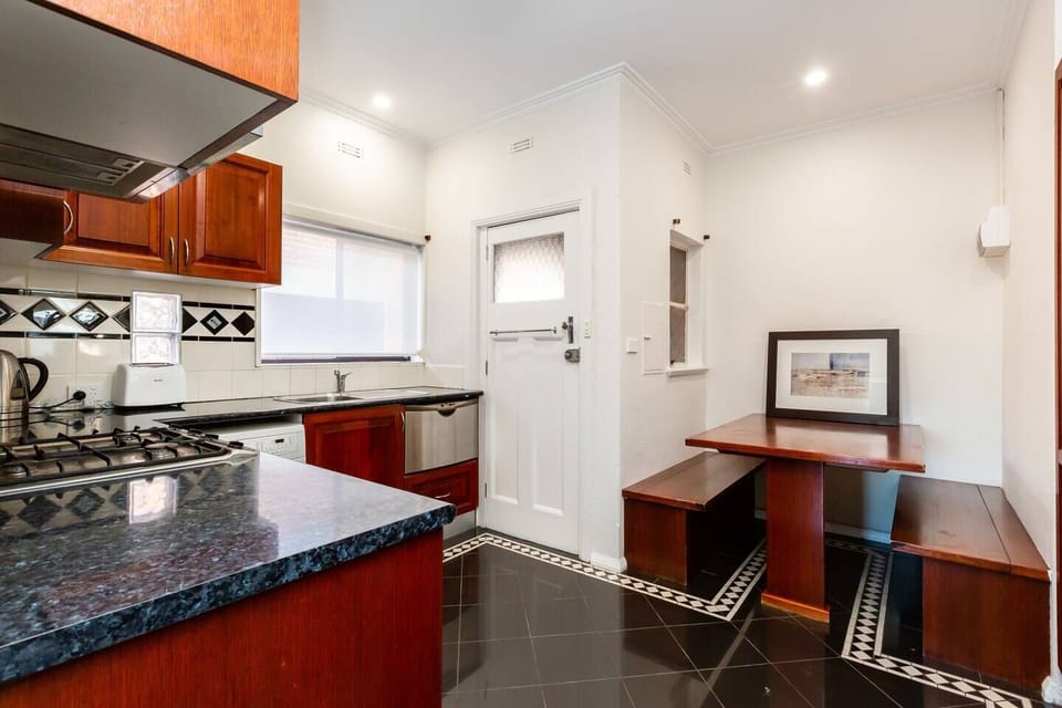The eat-in kitchen offers a nook to enjoy a quick bite at home before hitting the beach.