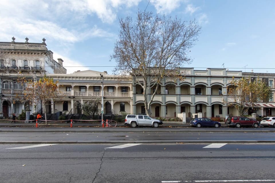 The entrance to this studio on Nicholson Street is nestled in a nineteenth-century streetscape of terrace houses and wrought iron balconies.

