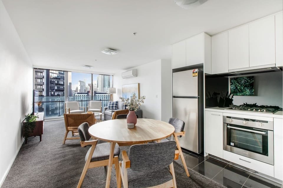 The open-plan dining area includes a dining table where you can share home-cooked meals or enjoy a takeaway dinner.