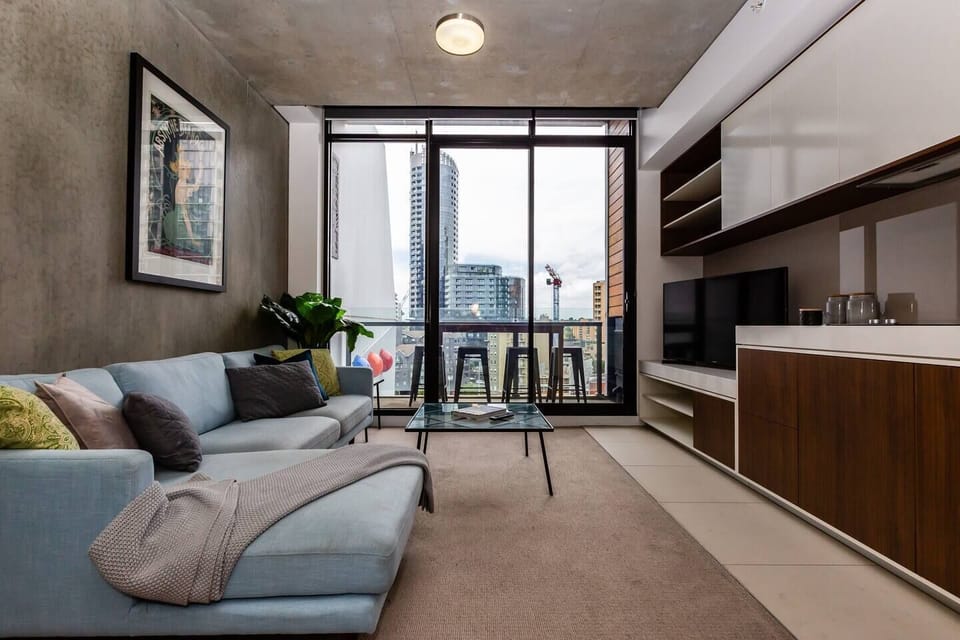 The main living area flows out to the furnished balcony boasting skyline views.
