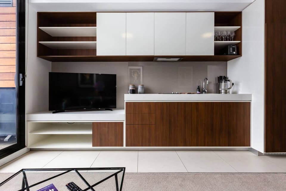 The galley kitchen is compact, but offers everything you'll need to cook up a feast at home.