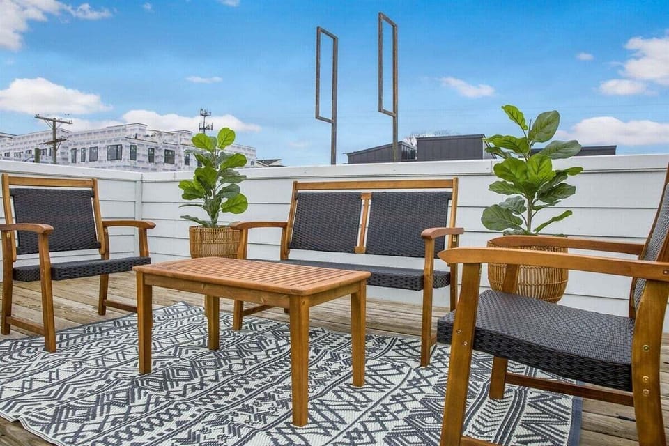 Relax in style with chic seating and skyline views.