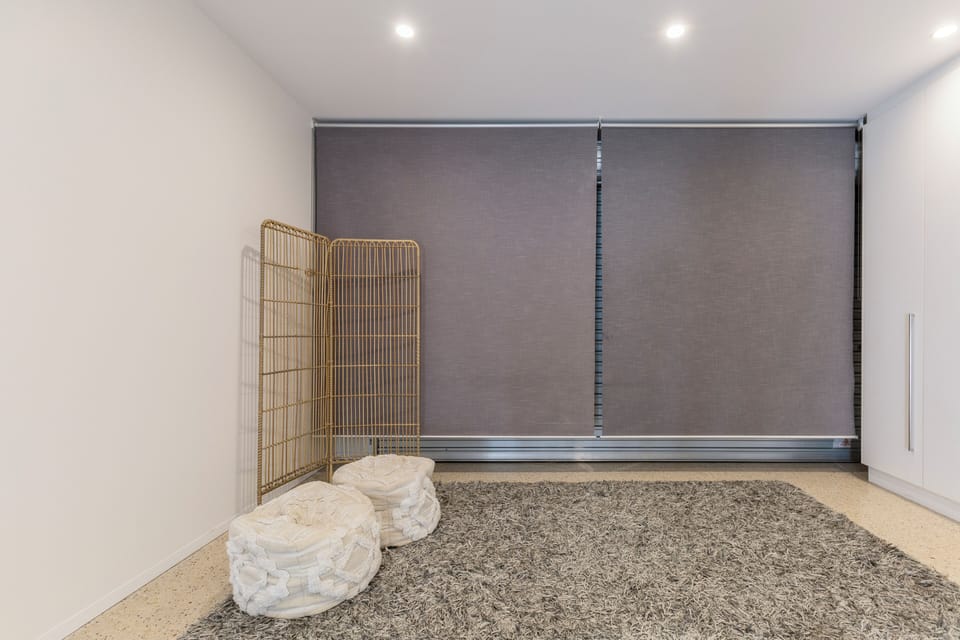 The townhouse is not a garage conversion, but there is a rear rolling door. The council requested that we install a roller door to match the appearance of the rear laneway.