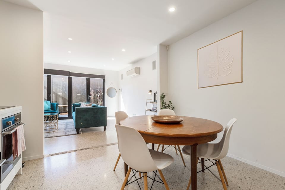 This stylish and modern space has split-level living with a downstairs living and dining area in an open-play layout.
