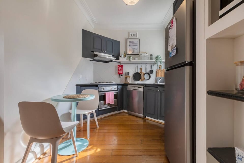 A two-seater table in the kitchen makes a convenient place for eating your meals
