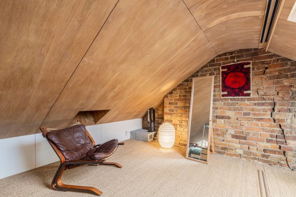 Cosy up in the mezzanine level of the third bedroom where the skylights light up the room with a sitting area and full-length mirror. 
