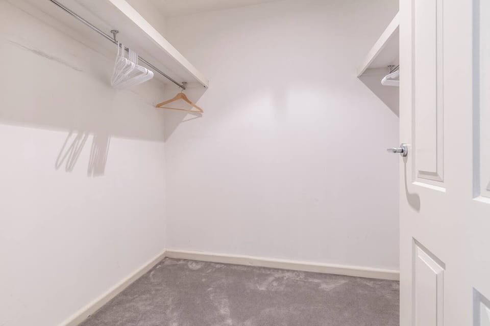 A walk-in closet provides ample space to store you luggage and belongings.