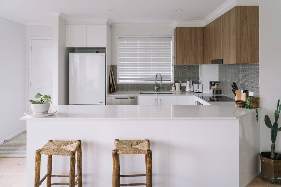 The kitchen is fully equipped with all the appliances you'll need to whip up a meal at home. There is a breakfast bar for slow mornings.