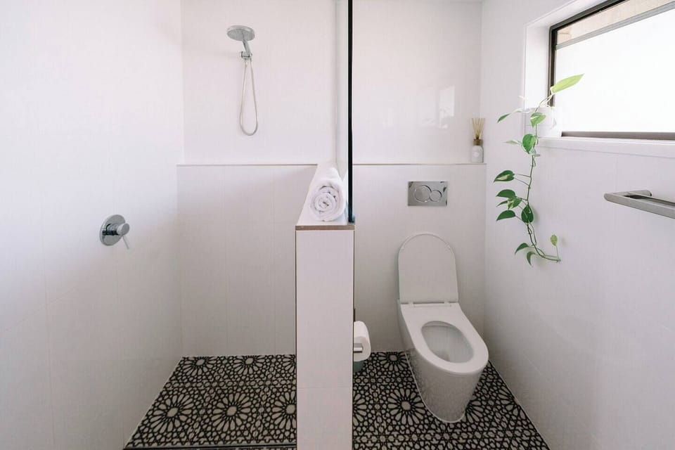The renovated bathroom has a gorgeous walk-in shower, toilet and mirrored vanity. Boutique toiletries are provided for your stay. 