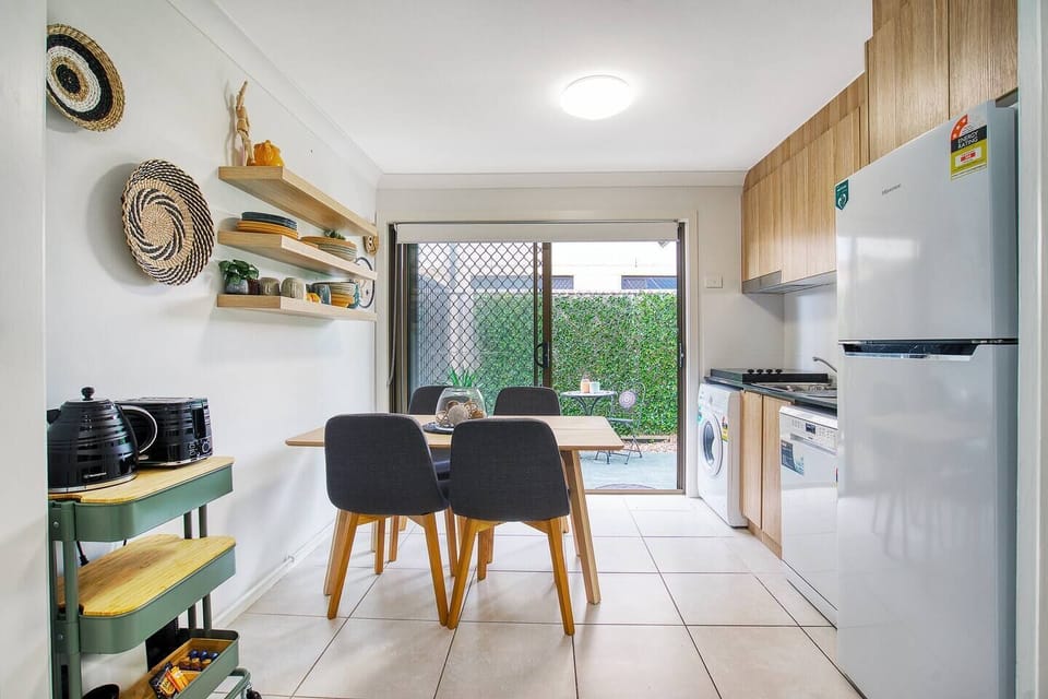 Spending the night in? Choose to dine indoors on the dining table fit for four guests that sits alongside the kitchen