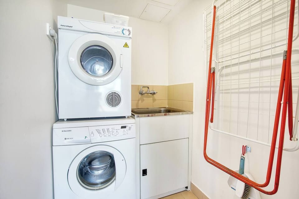 Easy to use Fisher and Paykel washing machine and dryer, plus a butler sink and clothes rack for any of your laundry needs. 