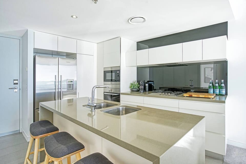 Whip up a delicious meal in the modern kitchen, fully equipped with stainless steel appliances and all your cooking essentials.
