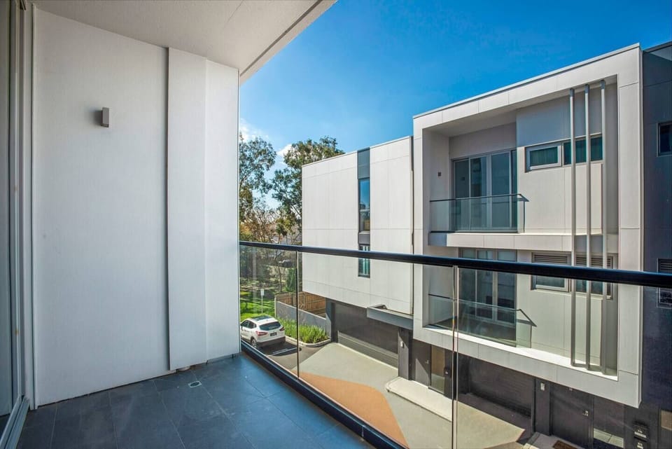 Step out onto the private balcony for a breath of fresh air, offering a simple outdoor space to enjoy quiet moments between outings.