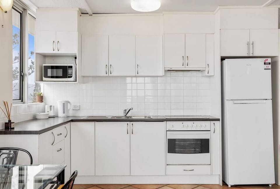 The kitchen is equipped with everything you need to whip up a delicious meal, with a fridge, oven, stove, microwave and coffee maker. 