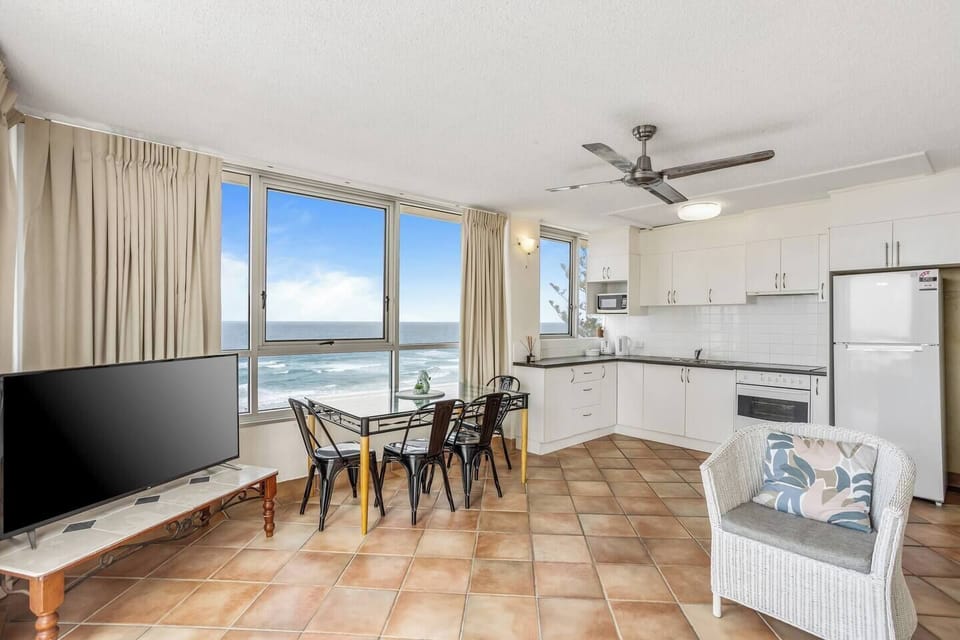 Sit down to a meal at home. There is a four person dining table with views directly across the water.
